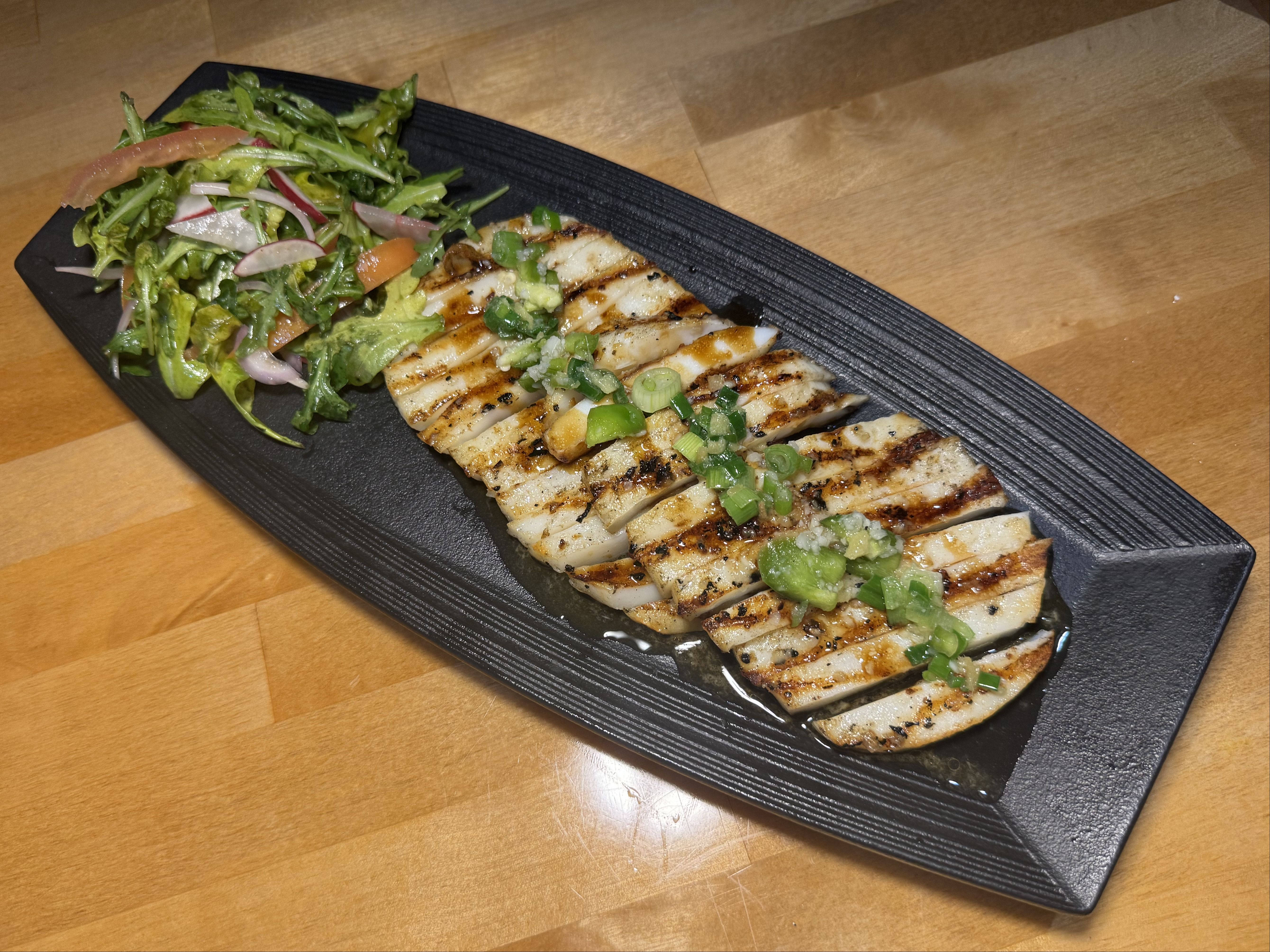 FLAME-GRILLED CALAMARI STEAKS.