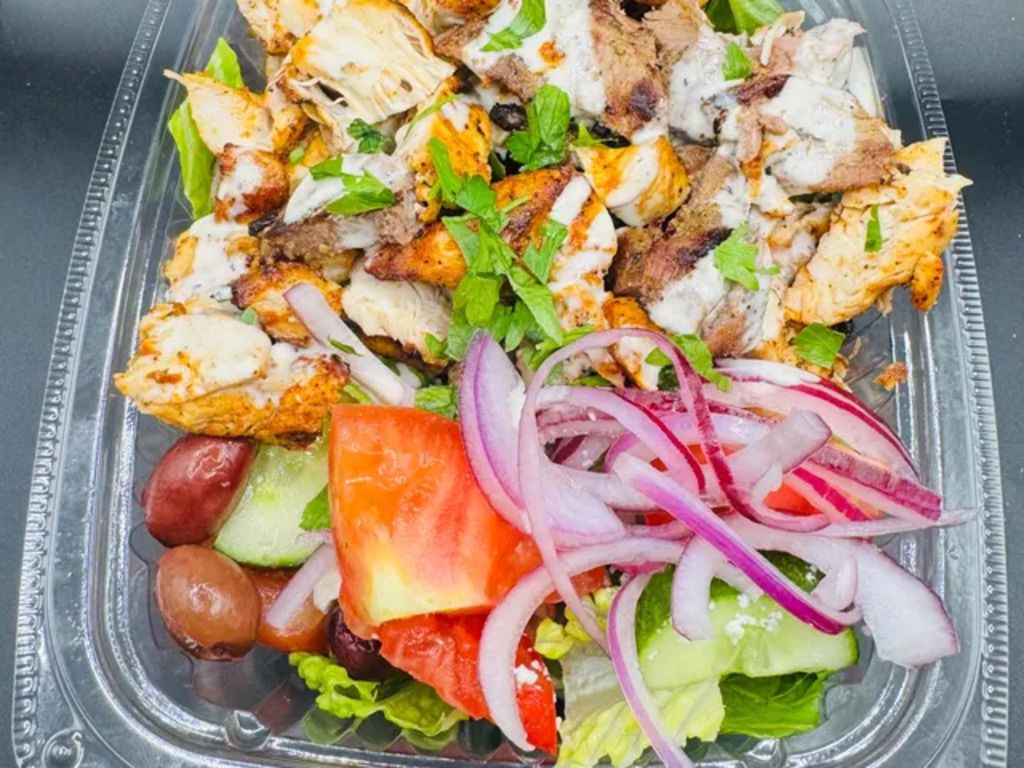 CHOPPED LAMB AND CHICKEN KABOB SALAD BOWL.
