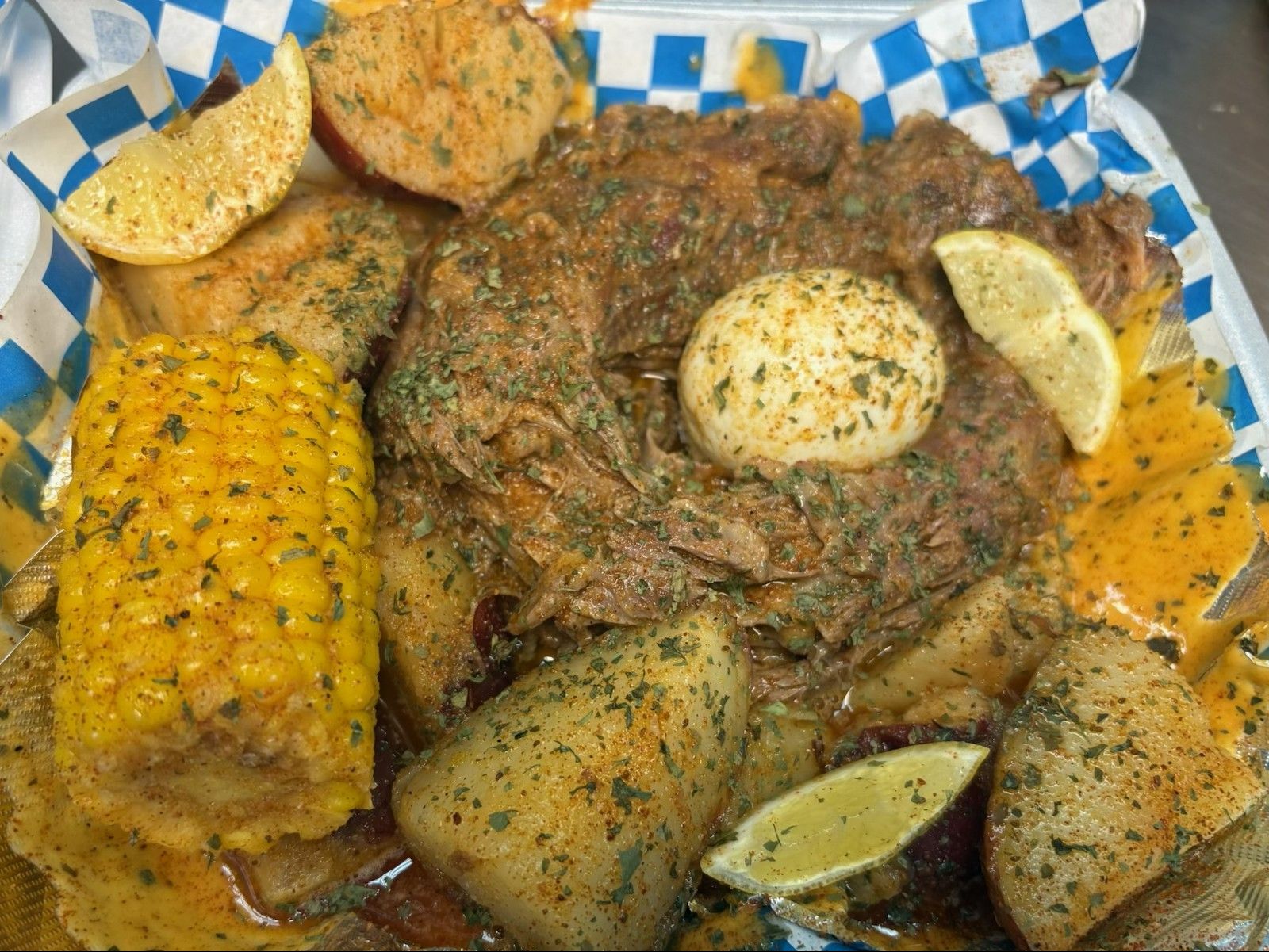 Turkey Neck w/Corn Potato and Cajun Boiled Egg.