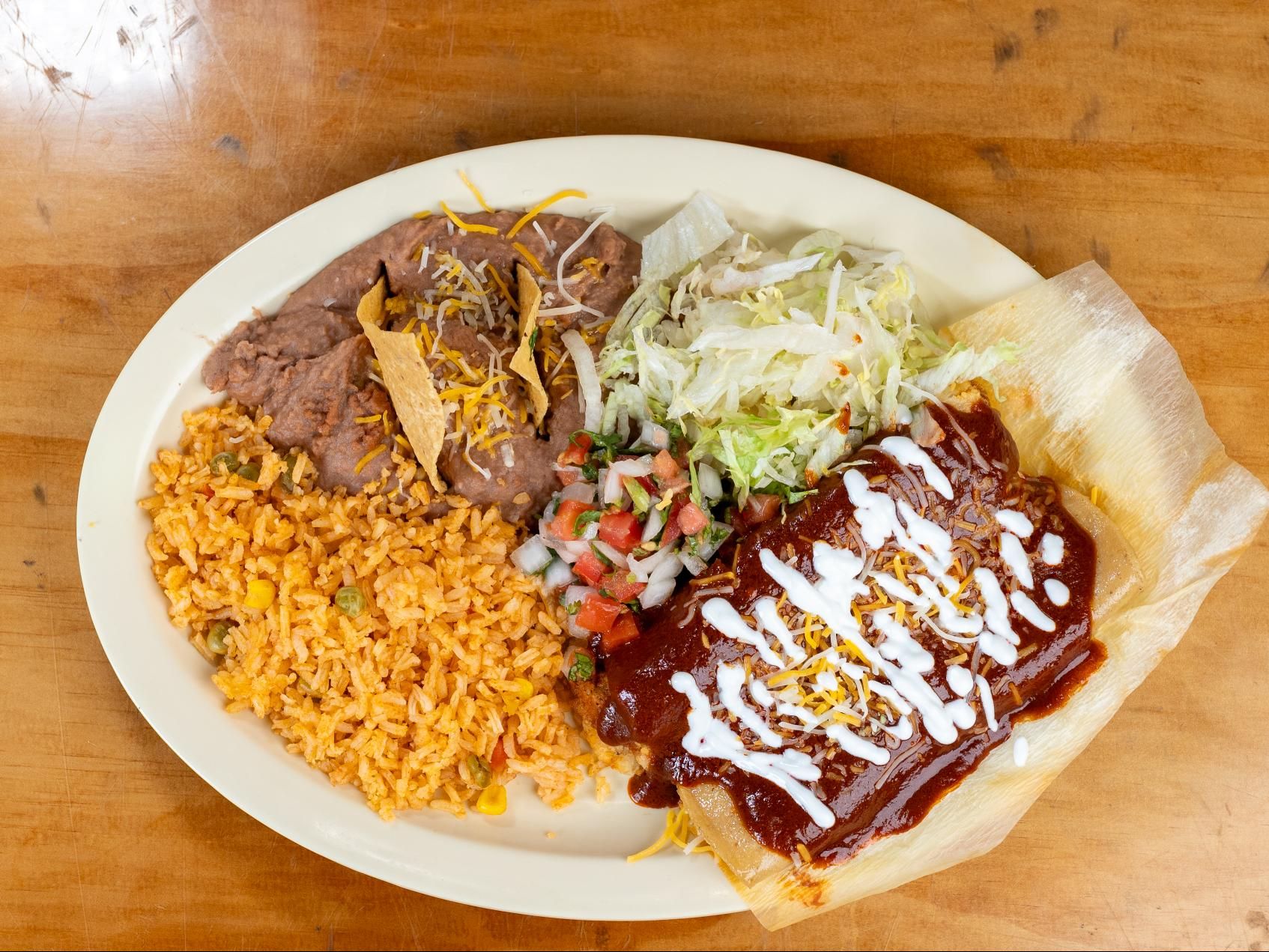 COMBO #1 Enchilada & Tamale.
