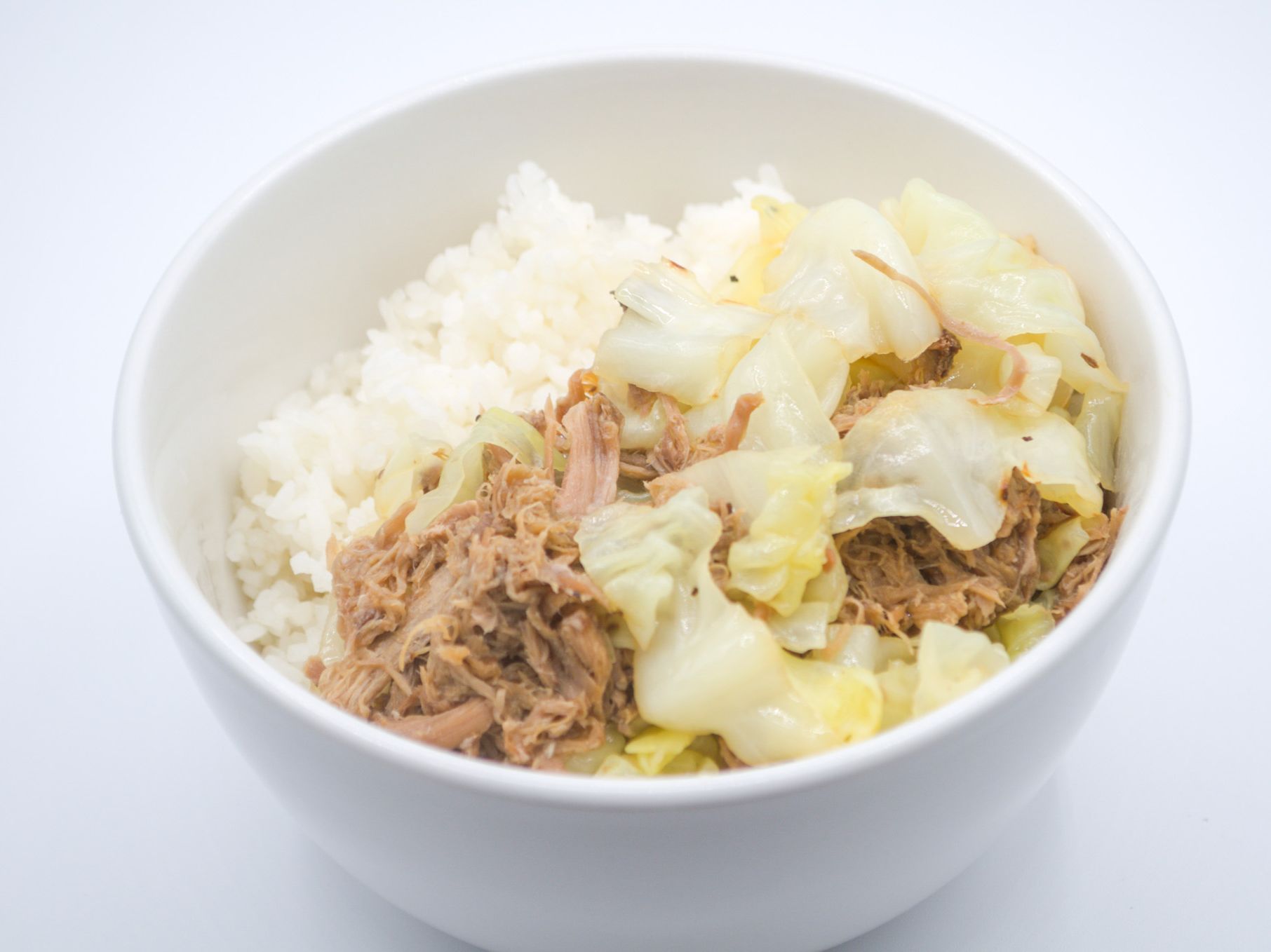 #21 Kalua Chicken Cabbage from Yama's Fish Market — Shredded chicken stewed with cabbage— light, savory, and comforting. Served over white rice.
