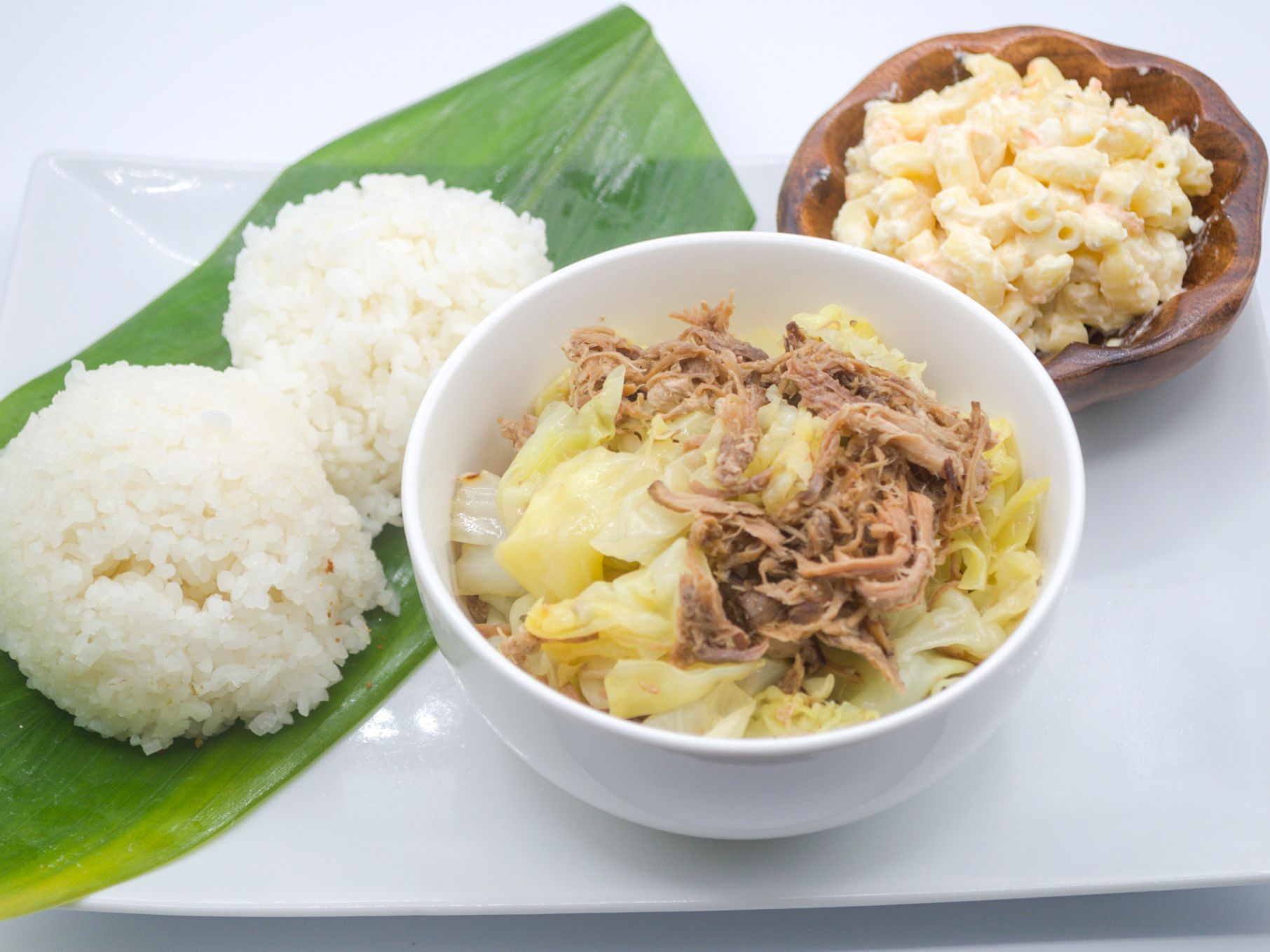 #12 Kalua Pig Cabbage from Yama's Fish Market — Smoky kalua pig sautéed with tender cabbage a true island comfort dish. Served with white rice and mac salad.