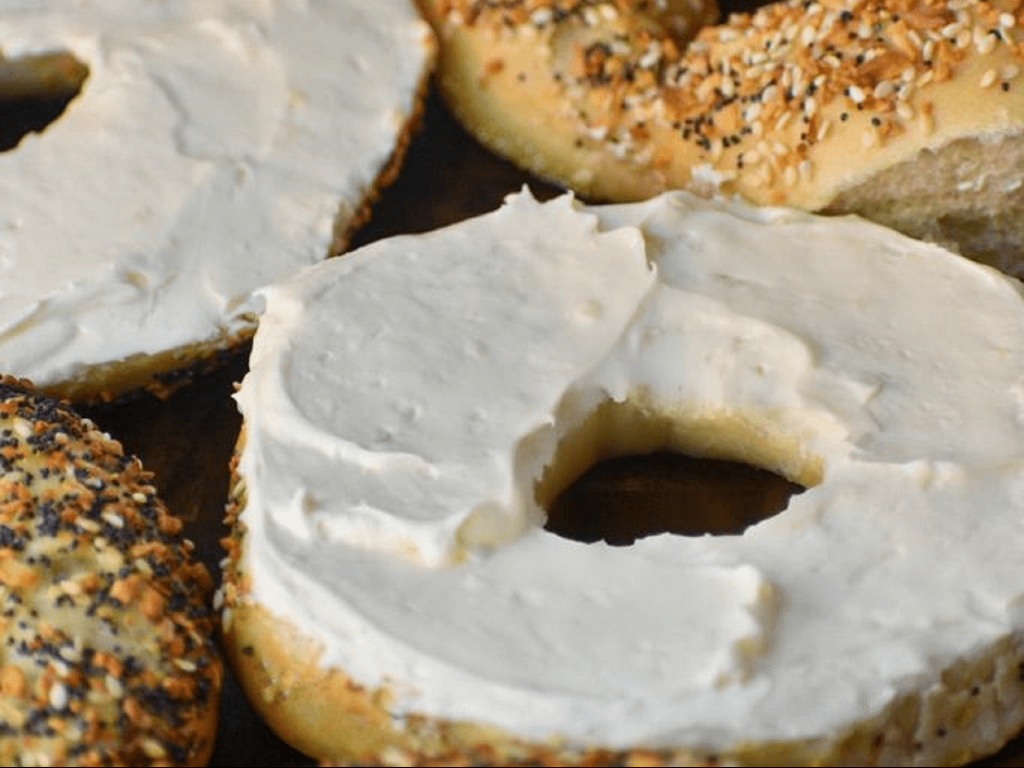 BAGEL W/ CREAM CHEESE & BUTTER (both sides).