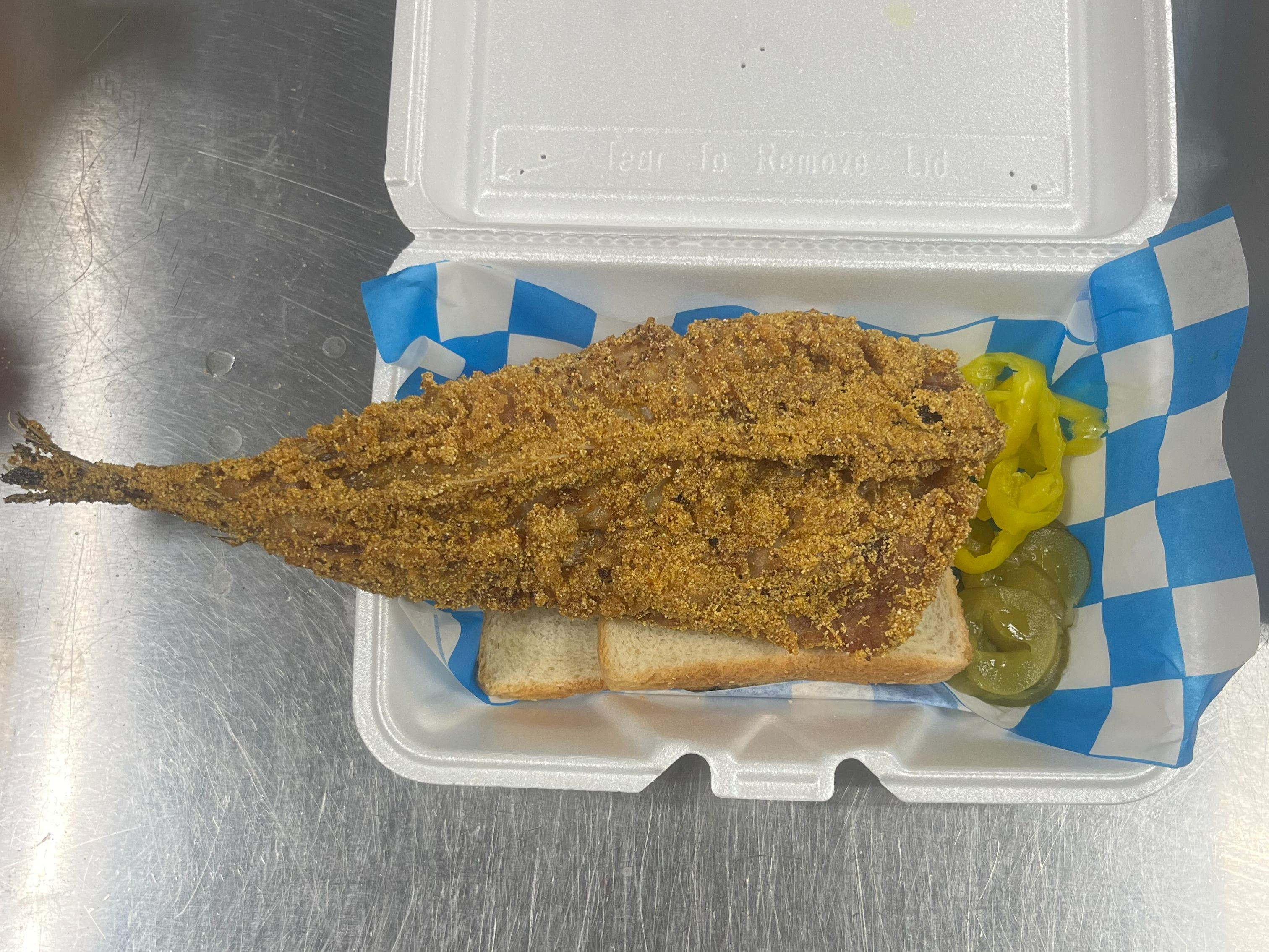 1 Piece Whole Whiting Sandwich with Pickles and Banana Peppers.