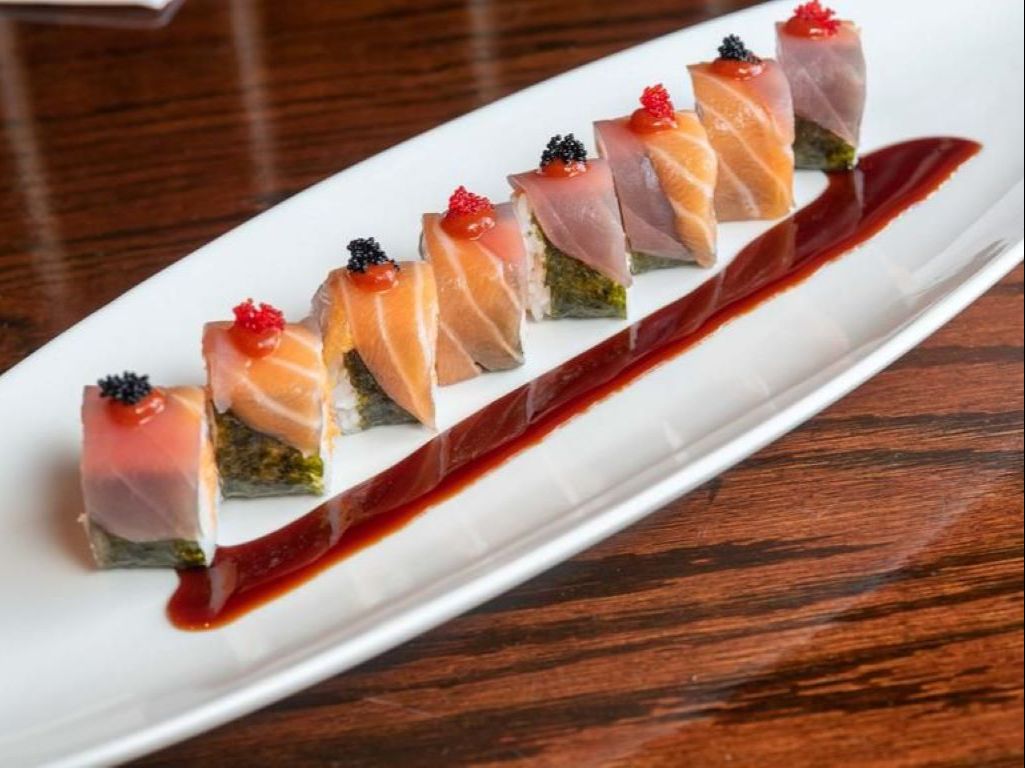 Halloween Roll - Spicy crab, sushi shrimp and tempura crunchy insid…k tobiko, eel sauce and hot sriracha sauce on top.