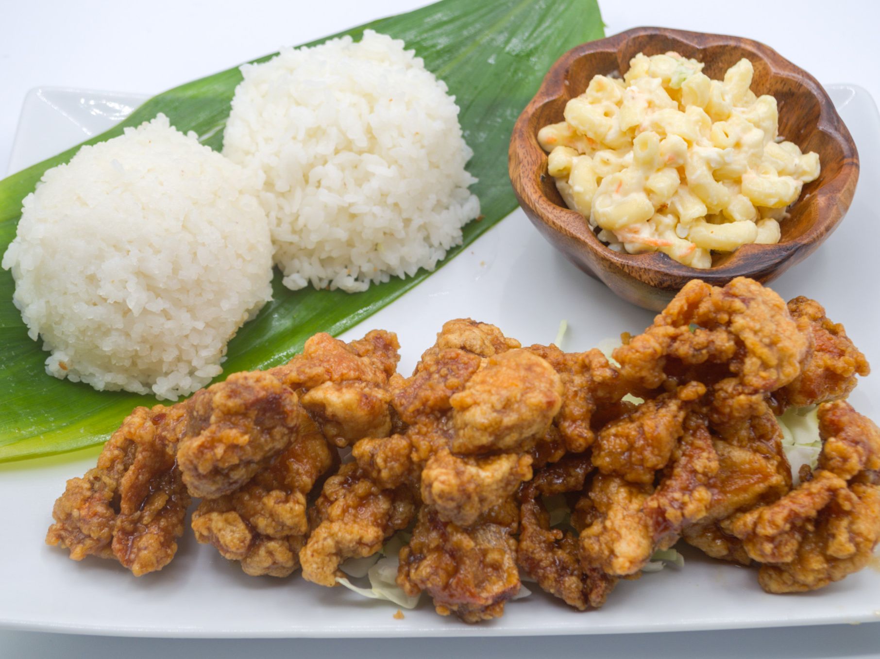 #26 Garlic Chicken from Yama's Fish Market — Bite-sized chicken fried crisp, then glazed in our in-house garlic sauce — sweet, salty, and packed with garlic flavor. Garnished with green onions. Served with white rice and mac salad.