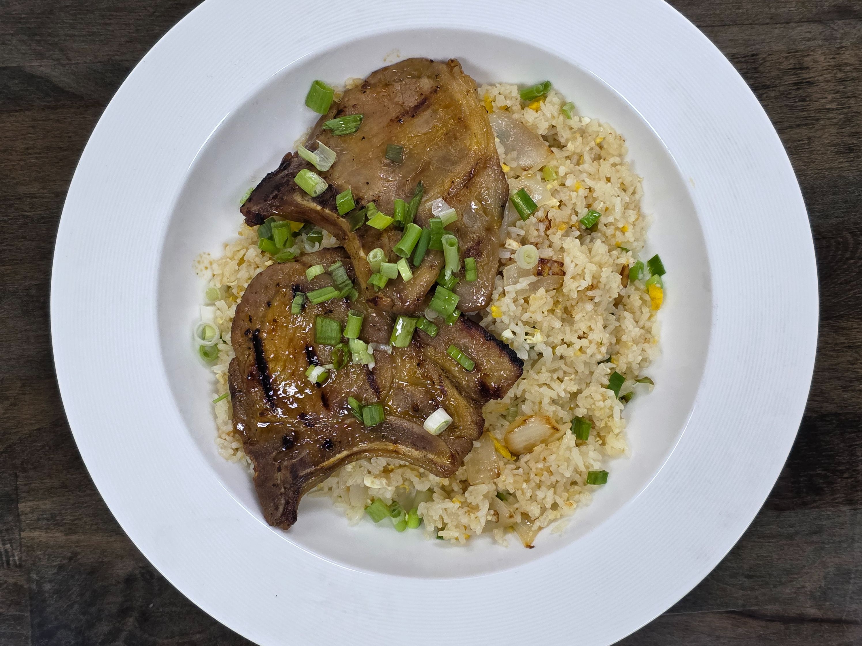 S4. Charbroiled Pork Chop Over Egg Fried Rice.