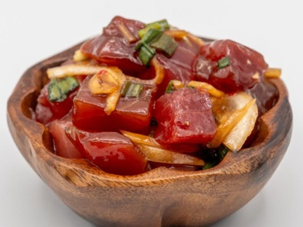 Spicy Ahi Poke from Yama's Fish Market — Our sashimi grade ahi with limu, sliced round onion, diced green onions and our spicy sauce mix. Click for available sizes/pricing