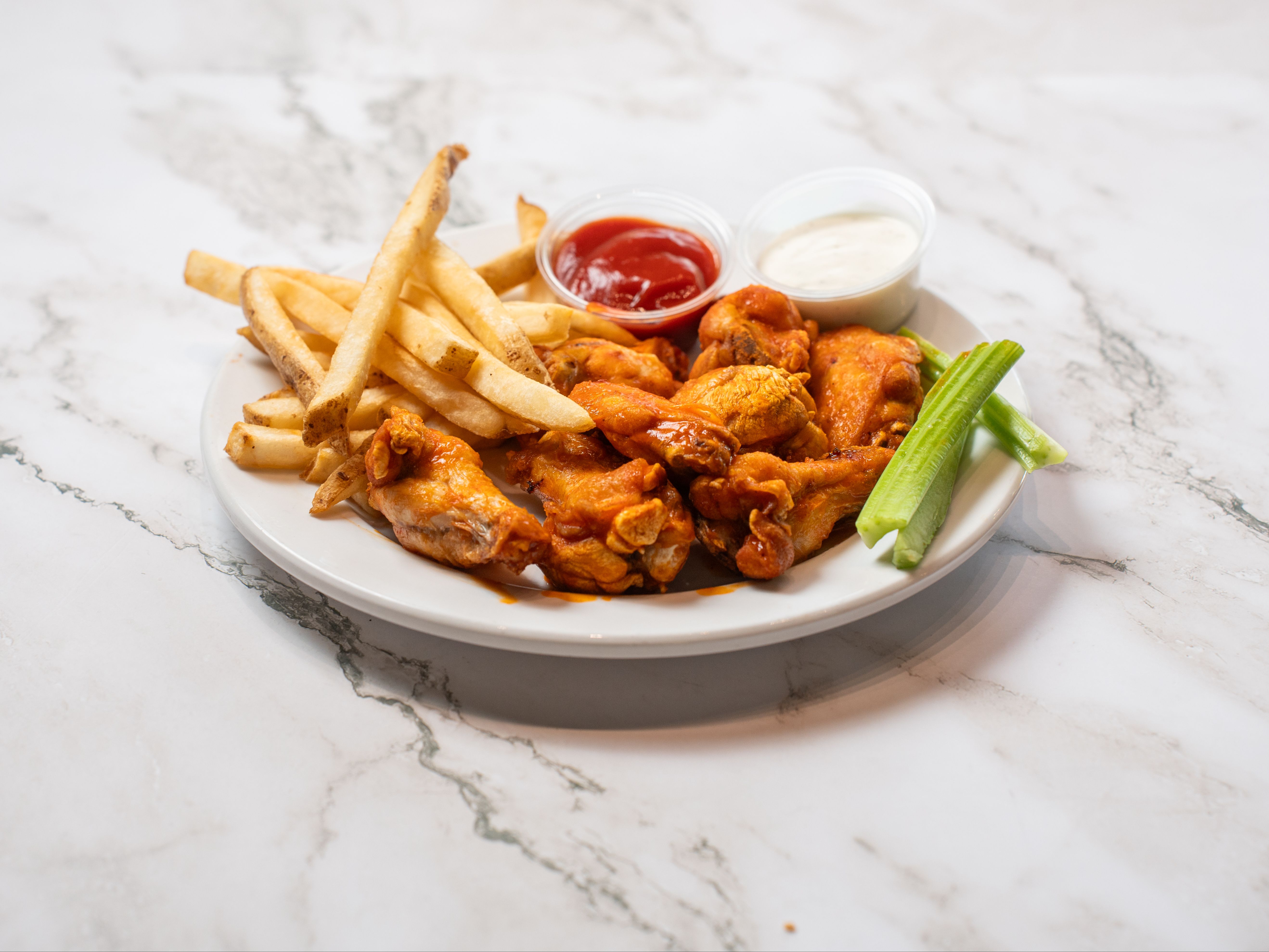 Chicken Wings and Fries.