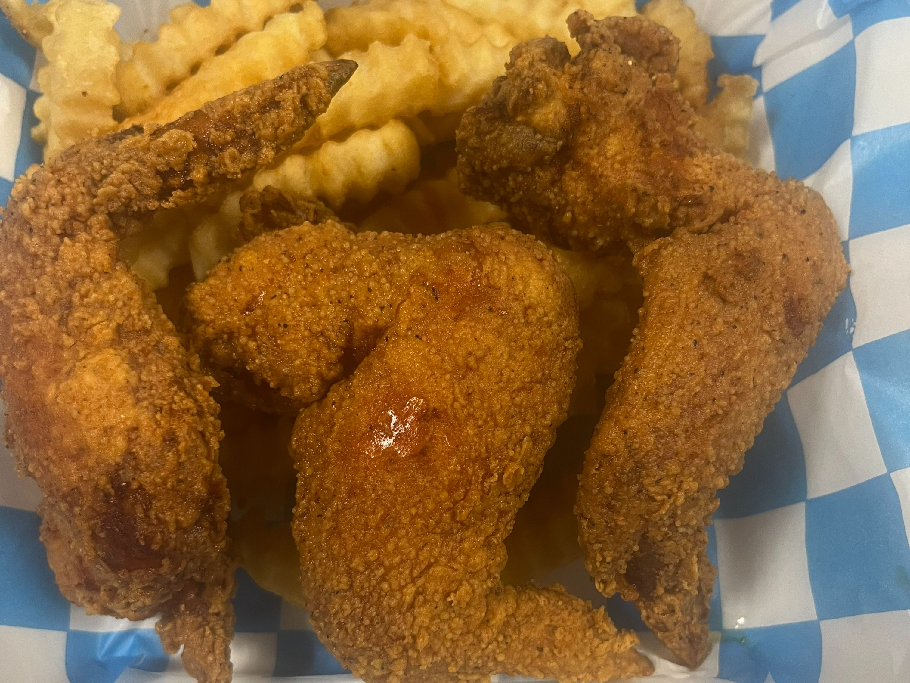 3 Piece Whole Chicken Wings with Fries and Can Pop.