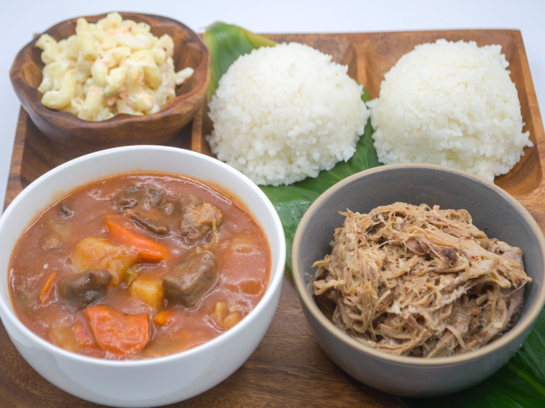 #9 Kalua Pig, Beef Stew & Mac Salad from Yama's Fish Market — Kalua pig paired with hearty beef stew, served with mac salad and white rice.