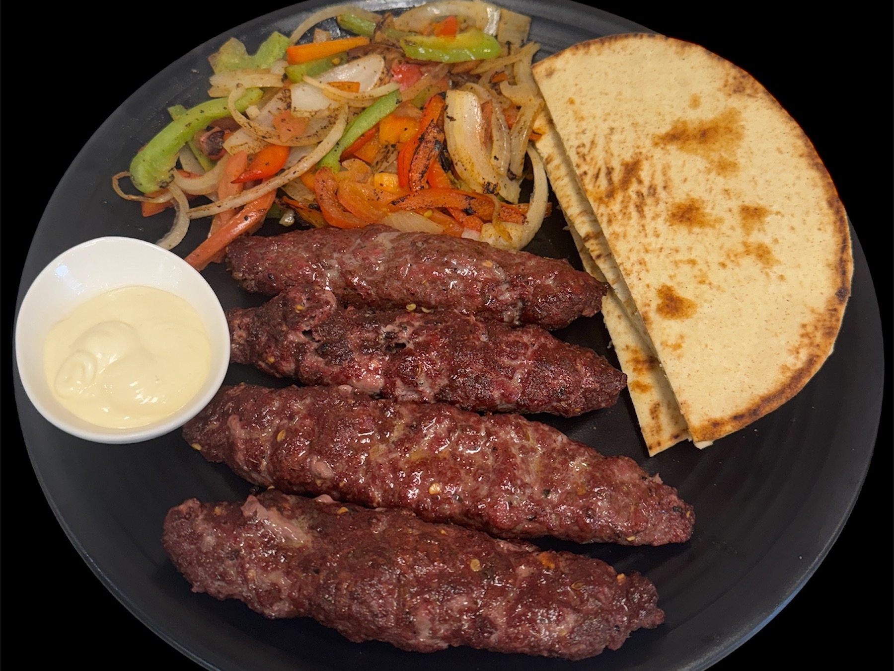Beef Kabab With Pita Bread ( 4 Pices Seekh Kabab,  2 Pita Bread, Sauted Vegi, Garlic Dip)