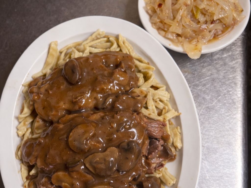Marinated Beef Over Kluski Noodles.