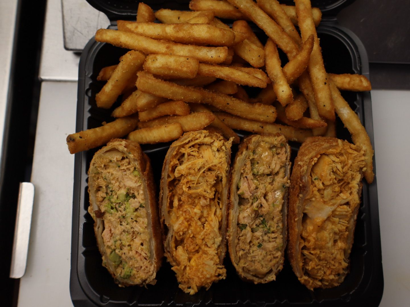 Half Buffalo chicken & Half Salmon eggrolls W/ fries