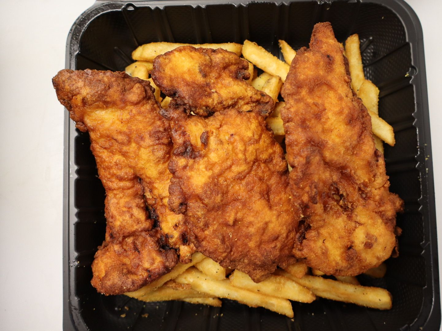 Crispy Chicken Tenders With Fries.