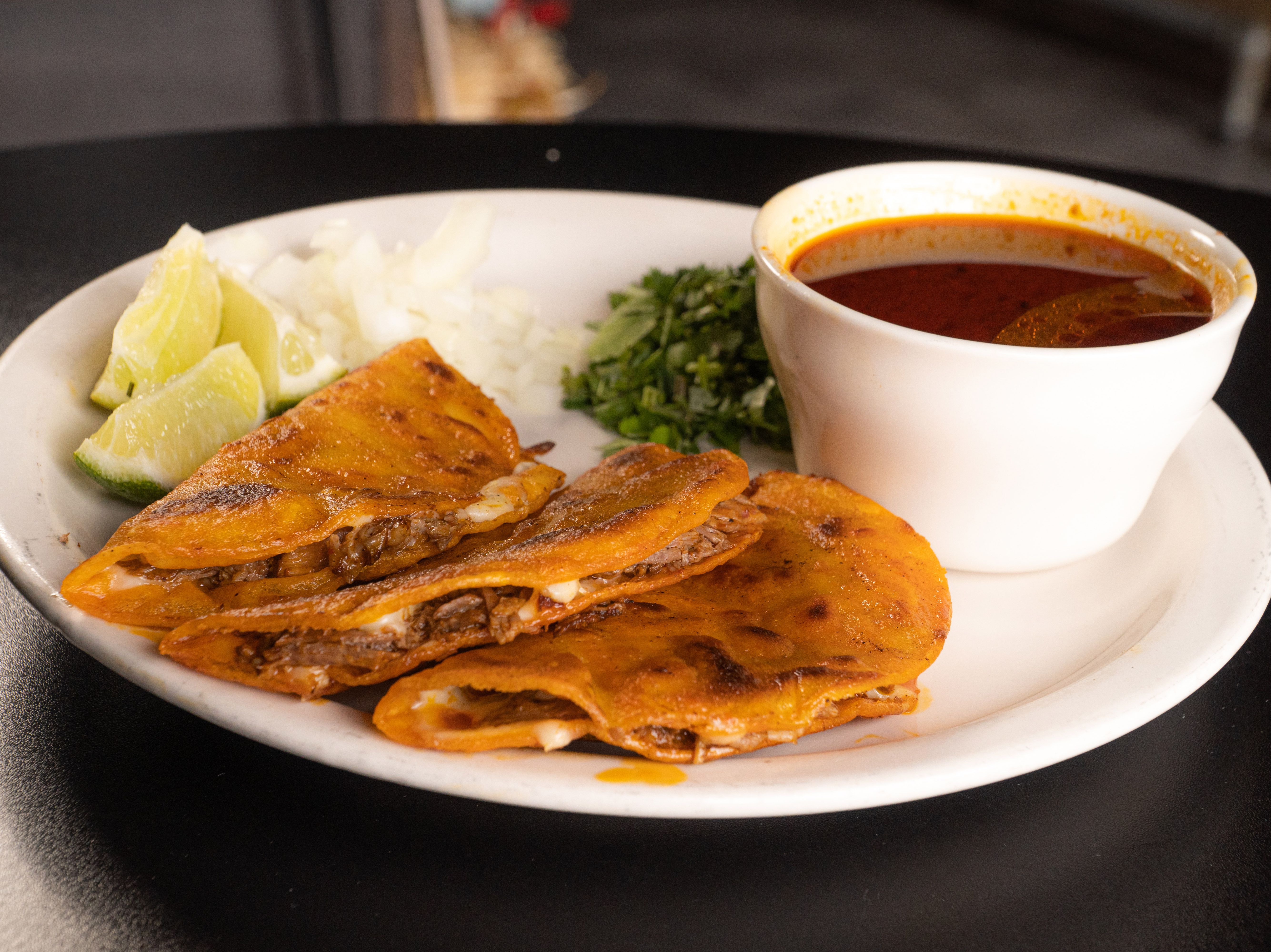 Three Queso-Birria Tacos with Consume